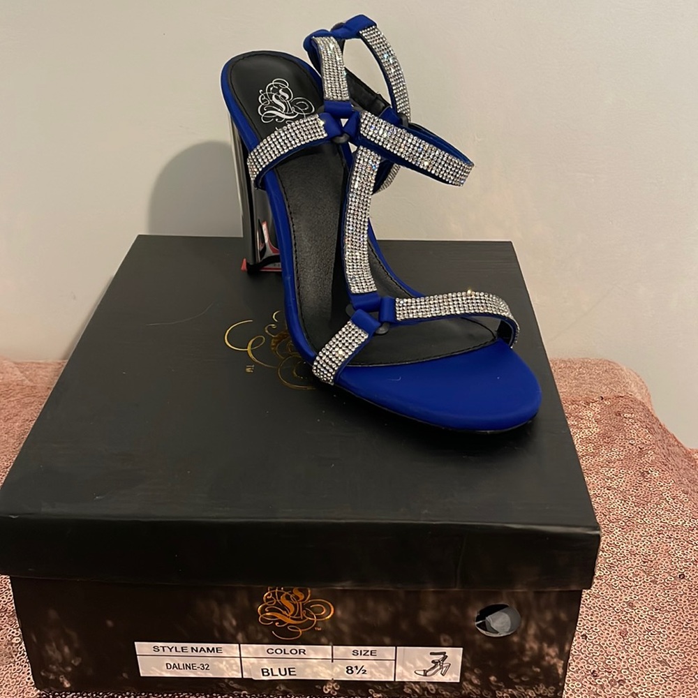 Beautiful blue strap up rhinestone heels! Make these an amazing statement piece!